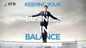 a man balancing on a tight-rope trying to keep his business in balance